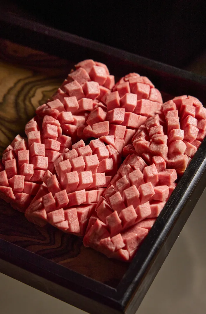 Scored beef prepared for grilling at Seolya Galbi